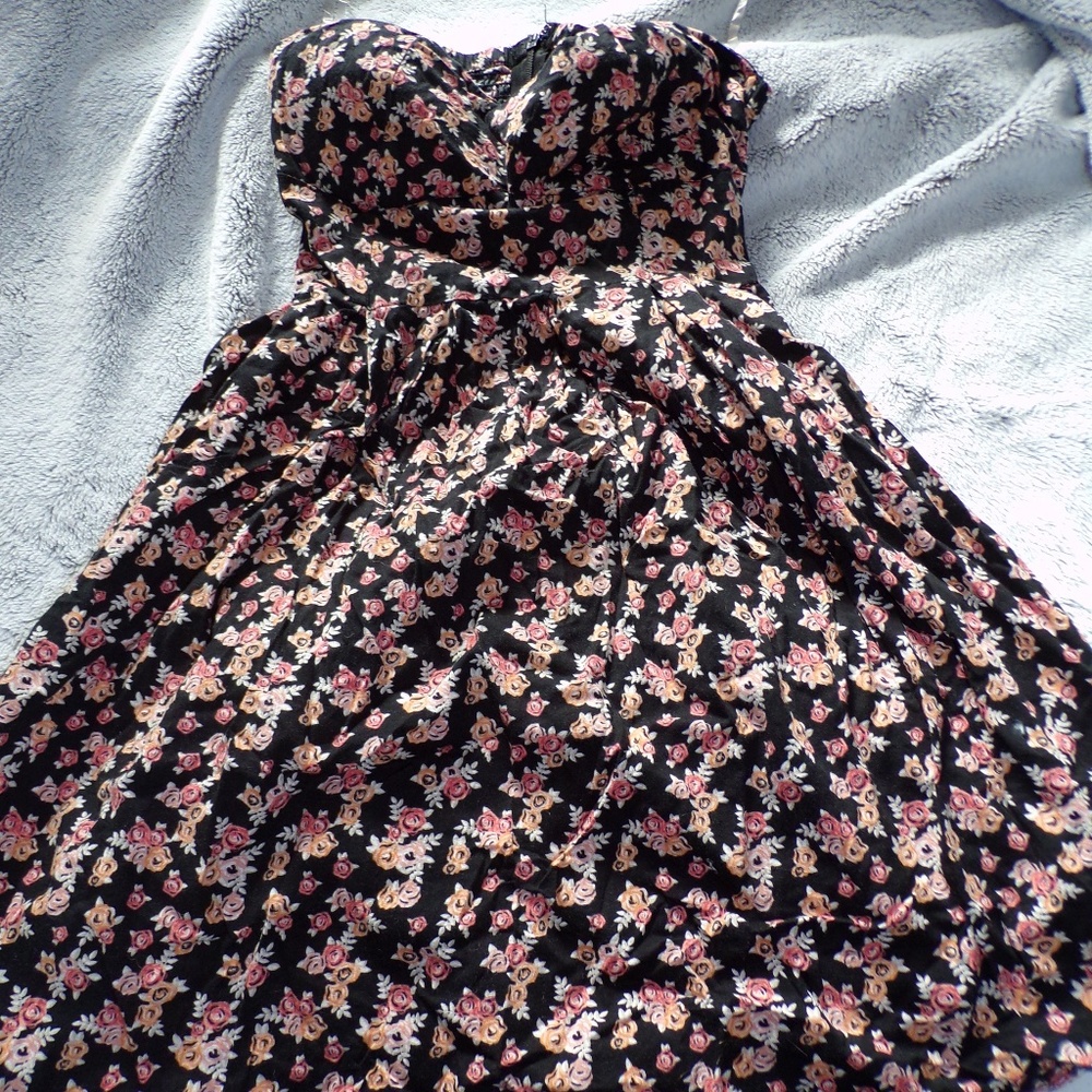 a sleeve less/ of the shoulder  dress